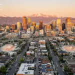 Denver skyline with Rocky Mountains showing STR market data analysis for 2026