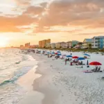 Gulf Shores Alabama beachfront with vacation rental condos along the white sand Gulf Coast shoreline