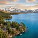 Lake Tahoe mountain lake view with cabins and Sierra Nevada mountains representing the short-term rental market