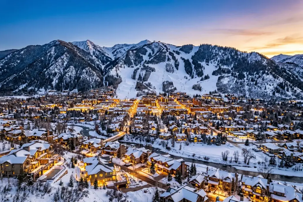 Aspen Colorado mountain town winter view with luxury vacation rental properties and ski slopes