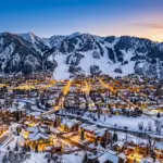 Aspen Colorado mountain town winter view with luxury vacation rental properties and ski slopes