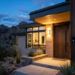 Modern vacation rental exterior with smart doorbell and outdoor camera at blue hour