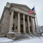 Federal courthouse with American flag representing constitutional challenges to STR bans