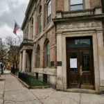 City hall building with code enforcement notice, representing STR enforcement technology