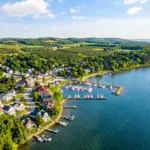 Door County Wisconsin vacation rental cabins along Green Bay waterfront with sailboats and cherry orchards