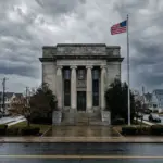 Federal courthouse exterior with residential neighborhood, representing federal court challenges to short-term rental ordinances in 2026