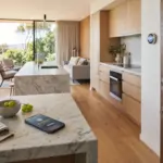 Smart home technology in a modern Airbnb rental showing a tablet with 5-star review interface and smart lock