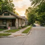 A quiet residential street with a rental sign and padlock, symbolizing an STR permit freeze in a Michigan neighborhood
