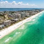 Aerial view of Destin Florida Emerald Coast beach and vacation rental properties