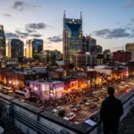 Nashville Tennessee skyline at dusk showing downtown Broadway district and AT&T Batman Building for STR property manager ranking article