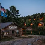 Hochatown Oklahoma resort community lake and cabins with local municipal building representing the Airbnb lodging tax misdirection lawsuit