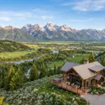 Jackson Hole Wyoming mountain cabin with Grand Teton peaks in background, summer 2026 STR market